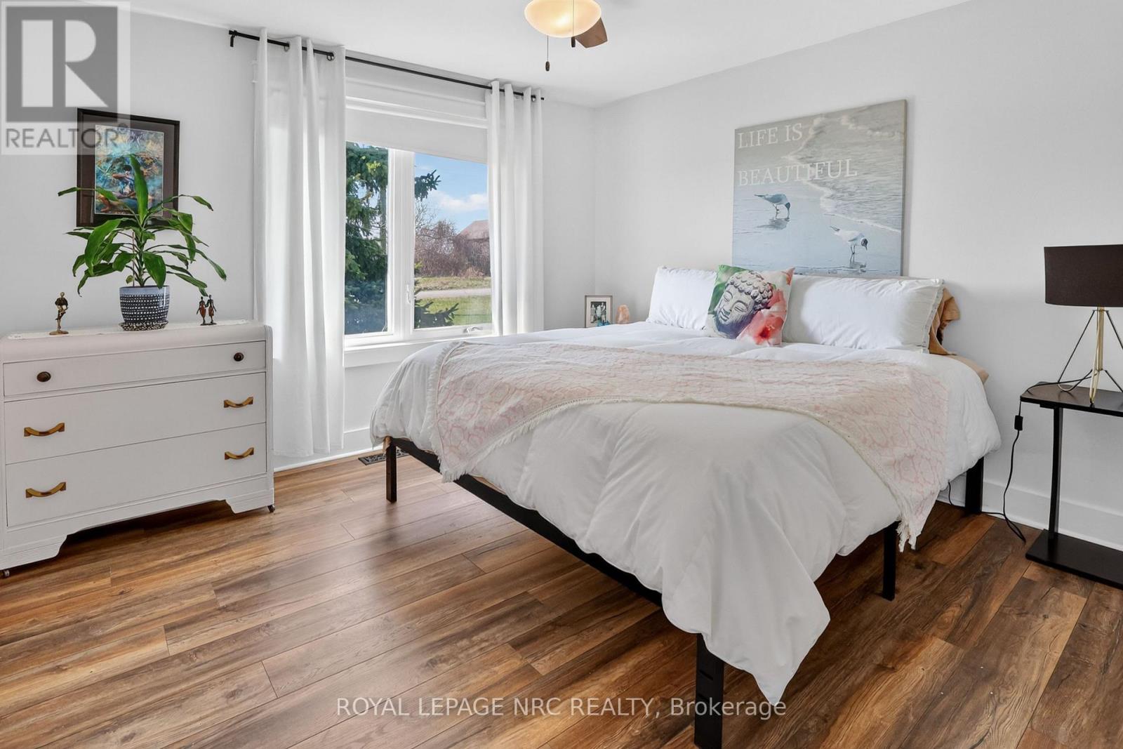PRIMARY BEDROOM WITH VIEWS OF THE GROUND
