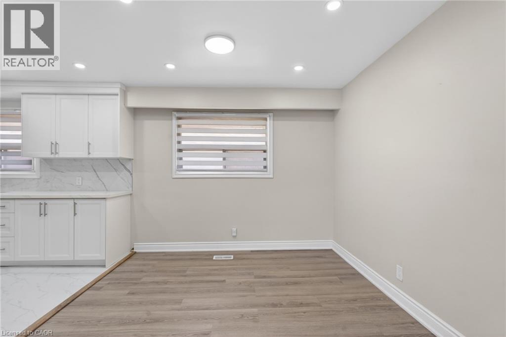 Neutral wall paint and wood-finish flooring provide a versatile foundation