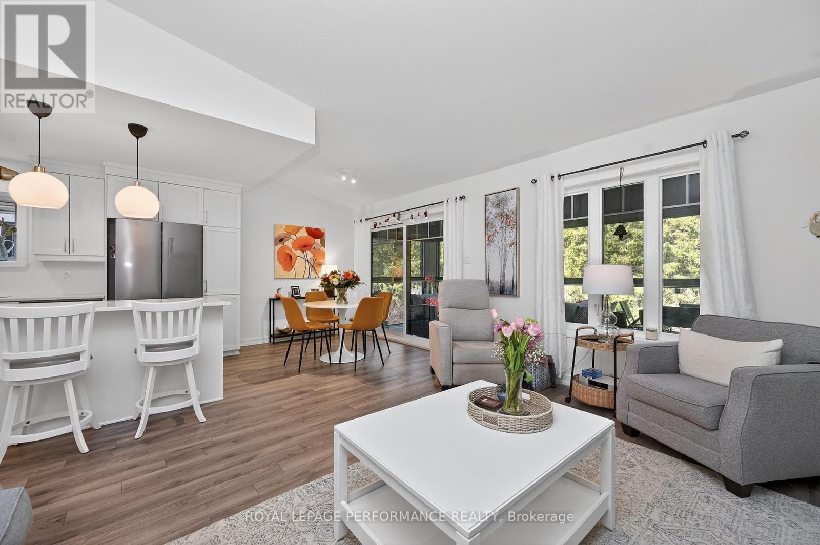 Open-concept living, dining, and kitchen.