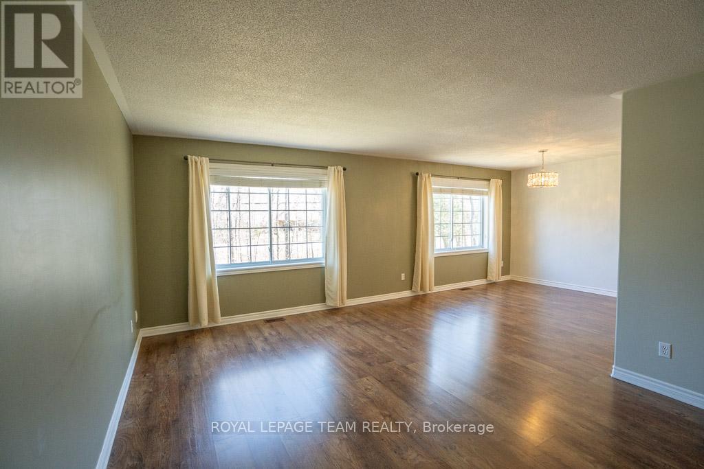 Huge living room overlooking the front yard
