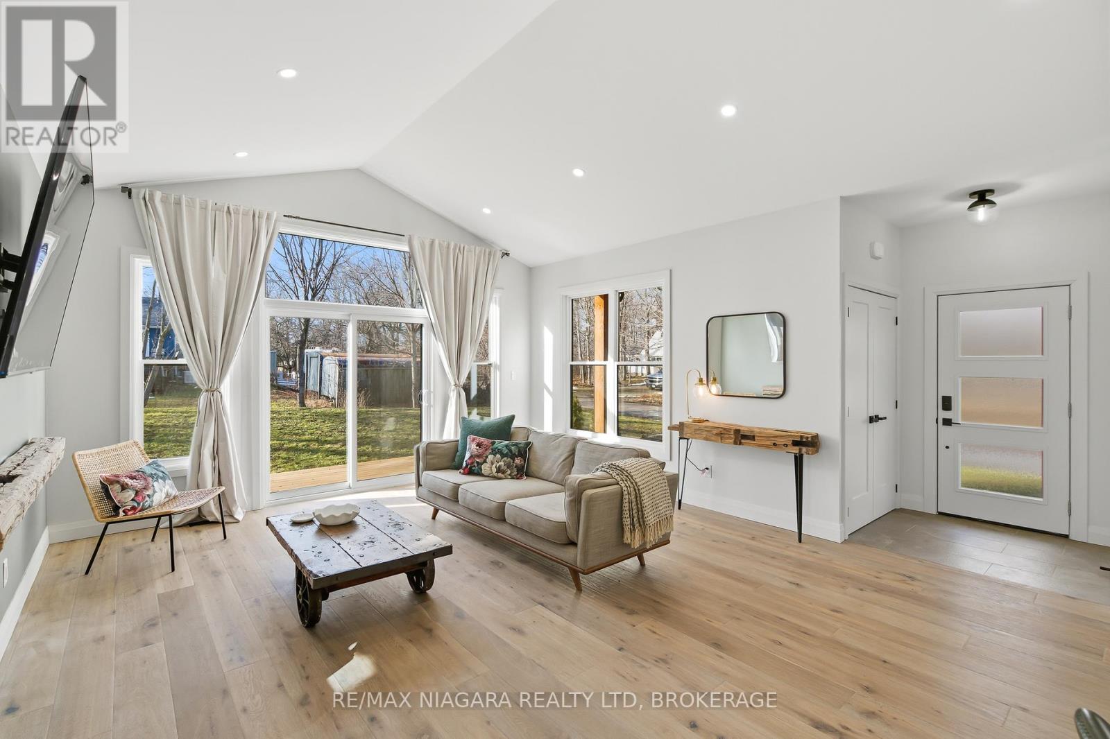 VAULTED CEILINGS AND PATIO DOORS TO DECK