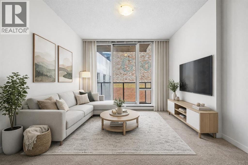 #306 450 8 AVENUE SE - 1