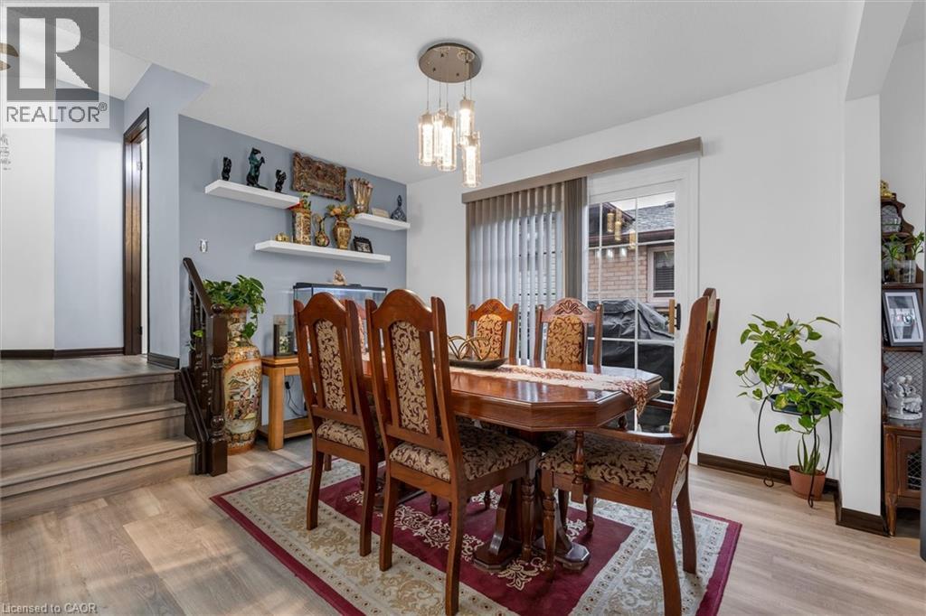 Dining room featuring light wood-style flooring and hanging lights