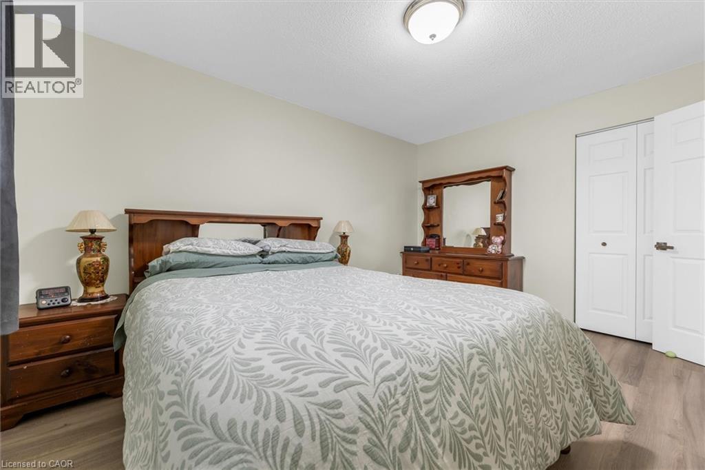 Bedroom featuring light wood-style floors and a closet