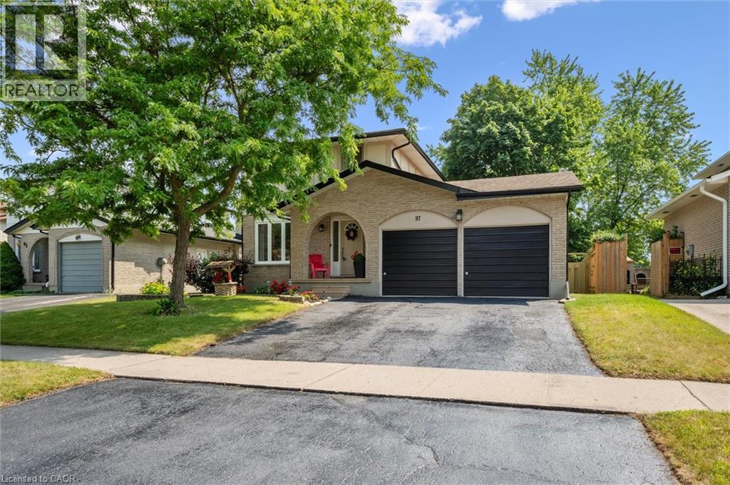 Brick exterior with arched entry and two-car garage