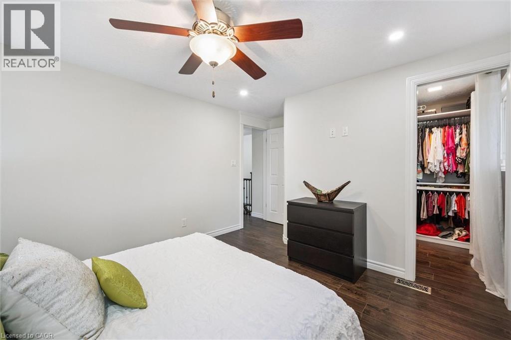 Interior room featuring wood-finish flooring, recessed lighting, and a ceiling fan with light fixture