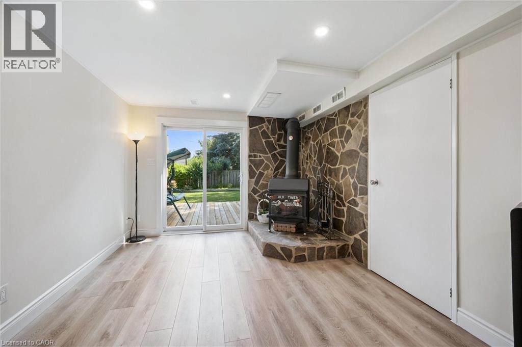 Bright living area featuring wood-finish flooring and recessed lighting