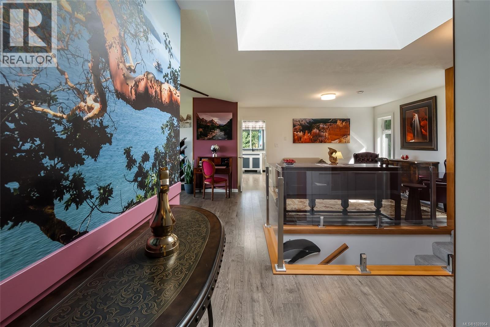 Bright and inviting with skylights and glass stairwell