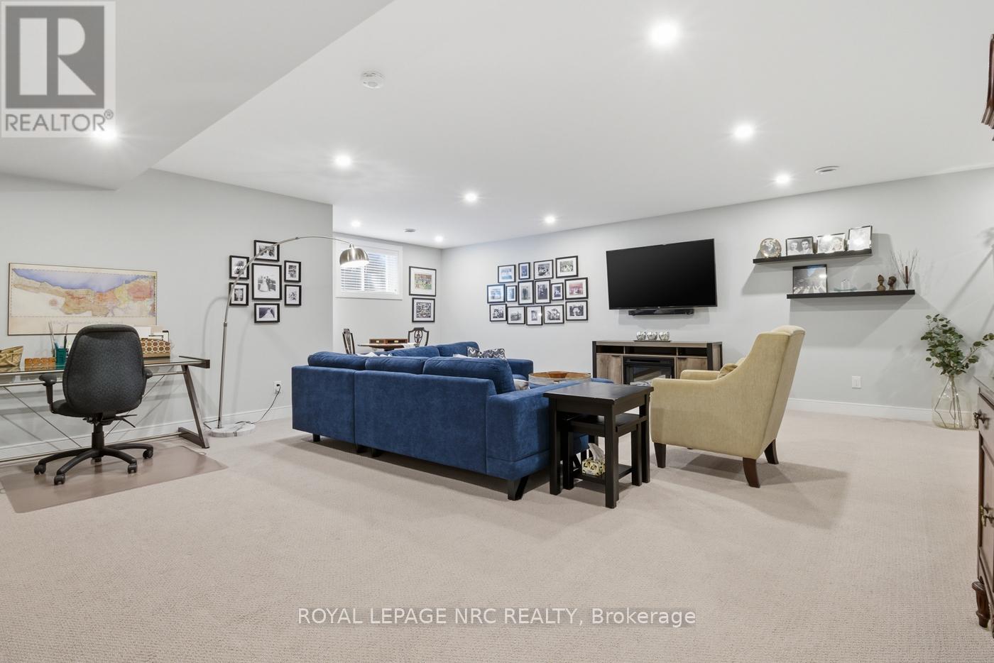 Huge Rec Room with high ceilings and potlights