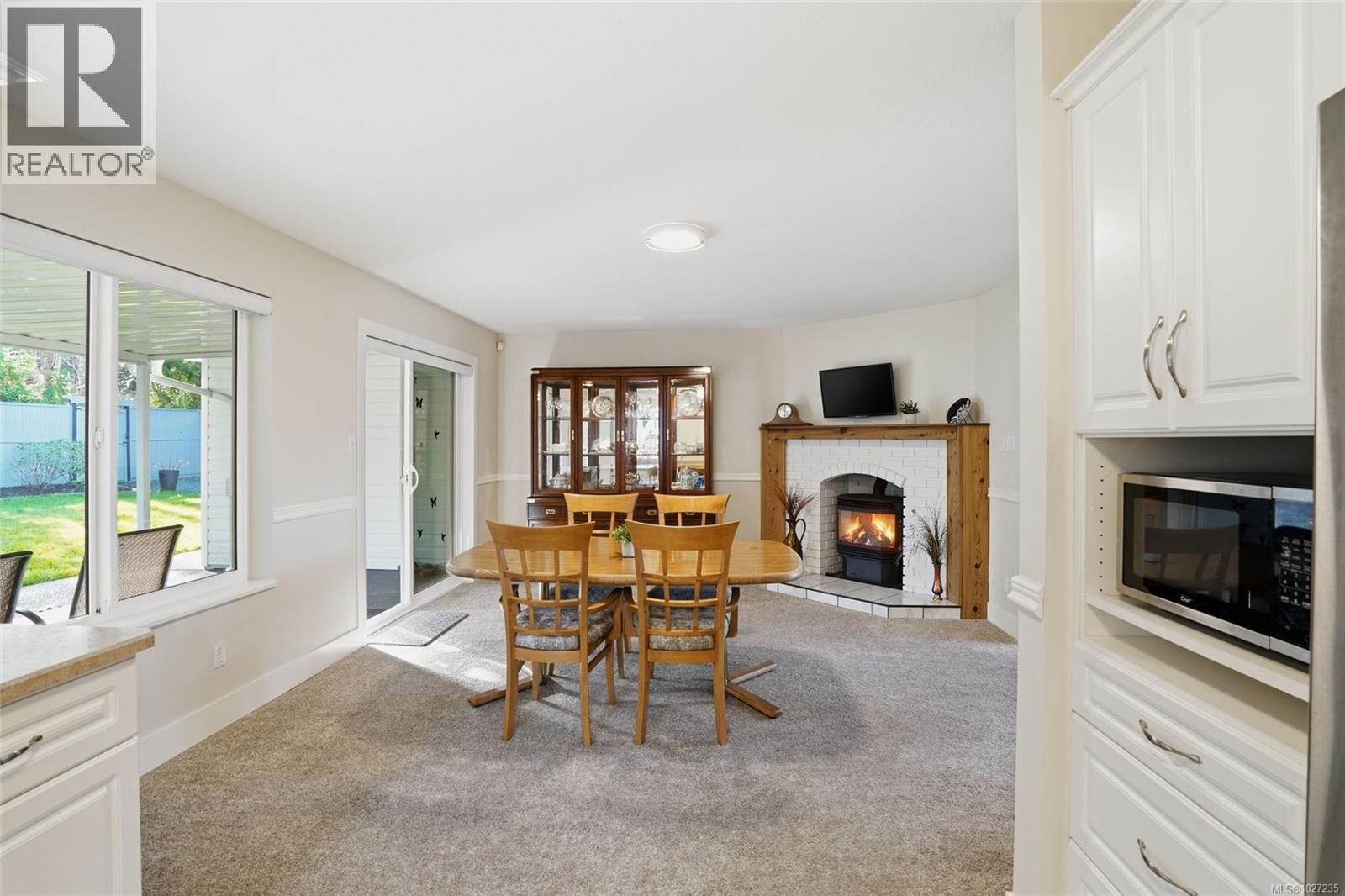 Multiple covered and uncovered patio areas off kitchen offer great outdoor living options.