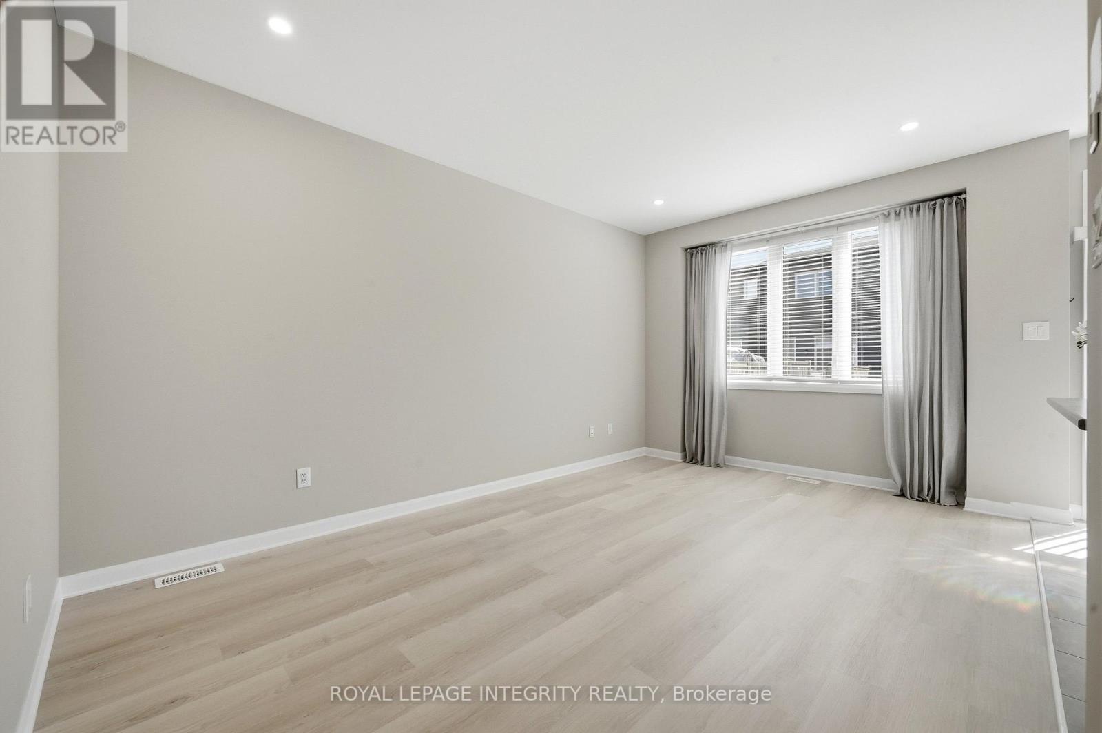Spacious bright living room with beautiful drapes