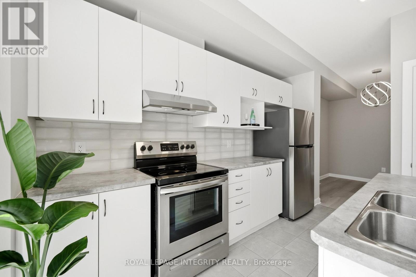 Sleek white cabinetry & stainless appliances