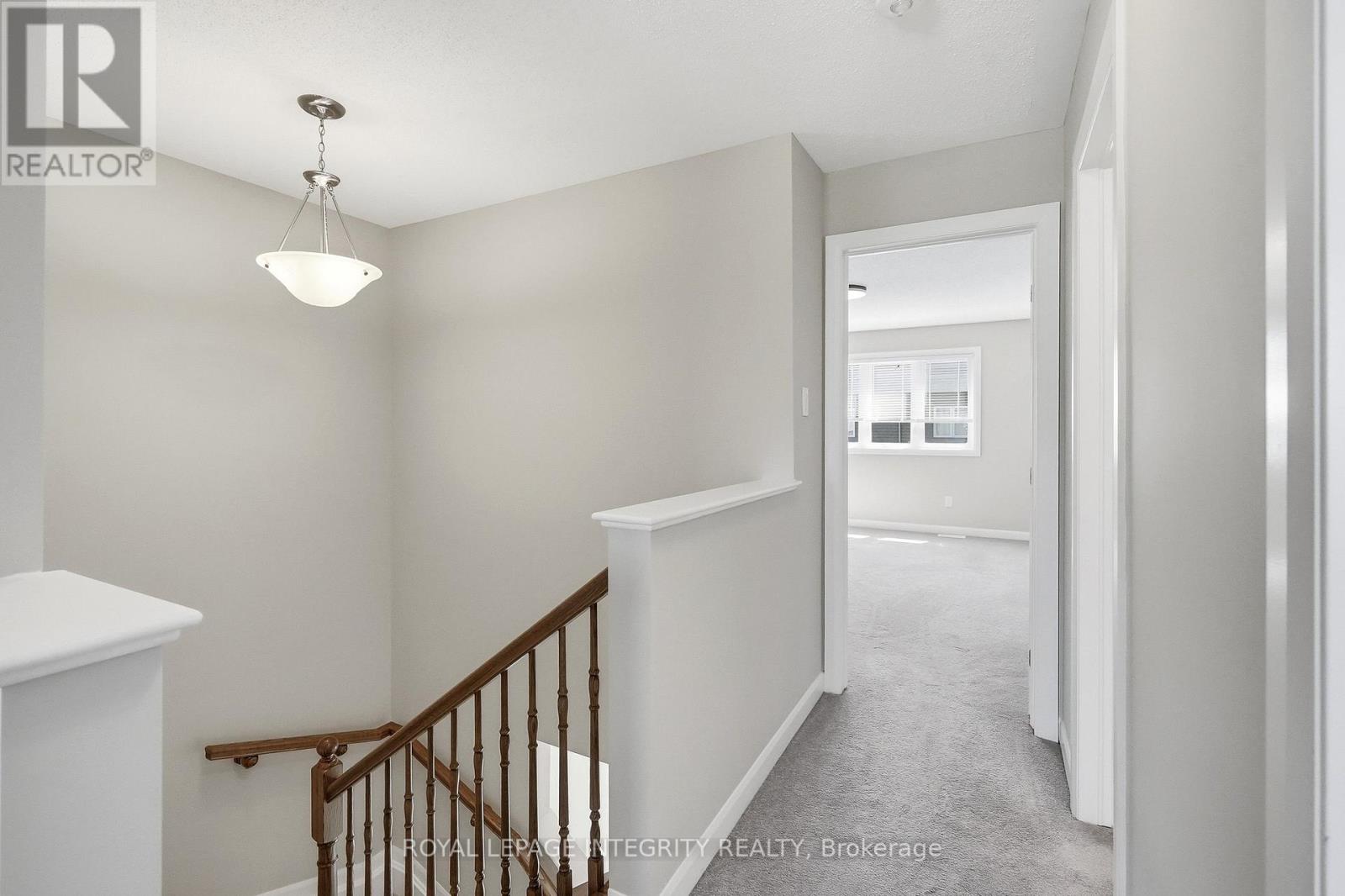 2nd level upper hallway leading to primary bedroom