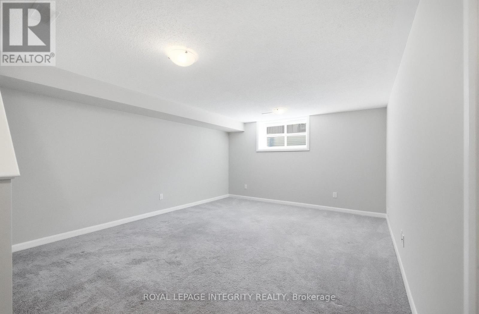 Huge basement rec room with sunny window