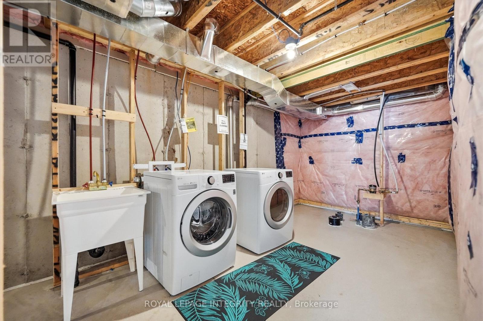 Laundry area with washer, dryer & storage