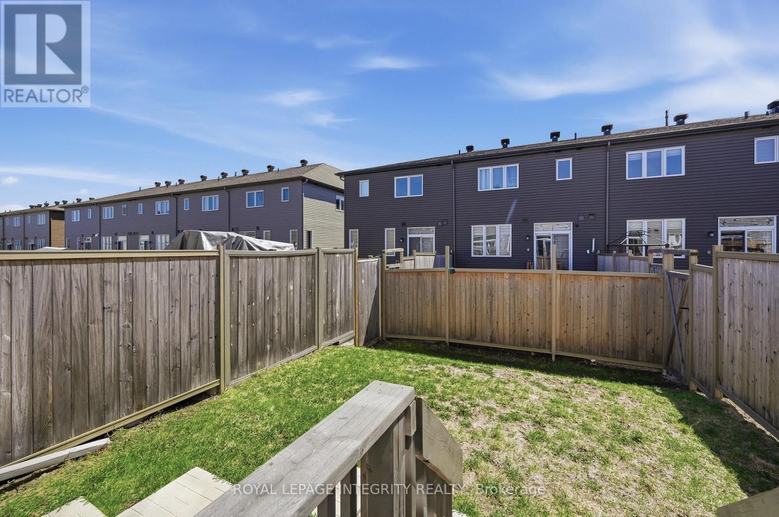 Patio door to south-facing fenced backyard