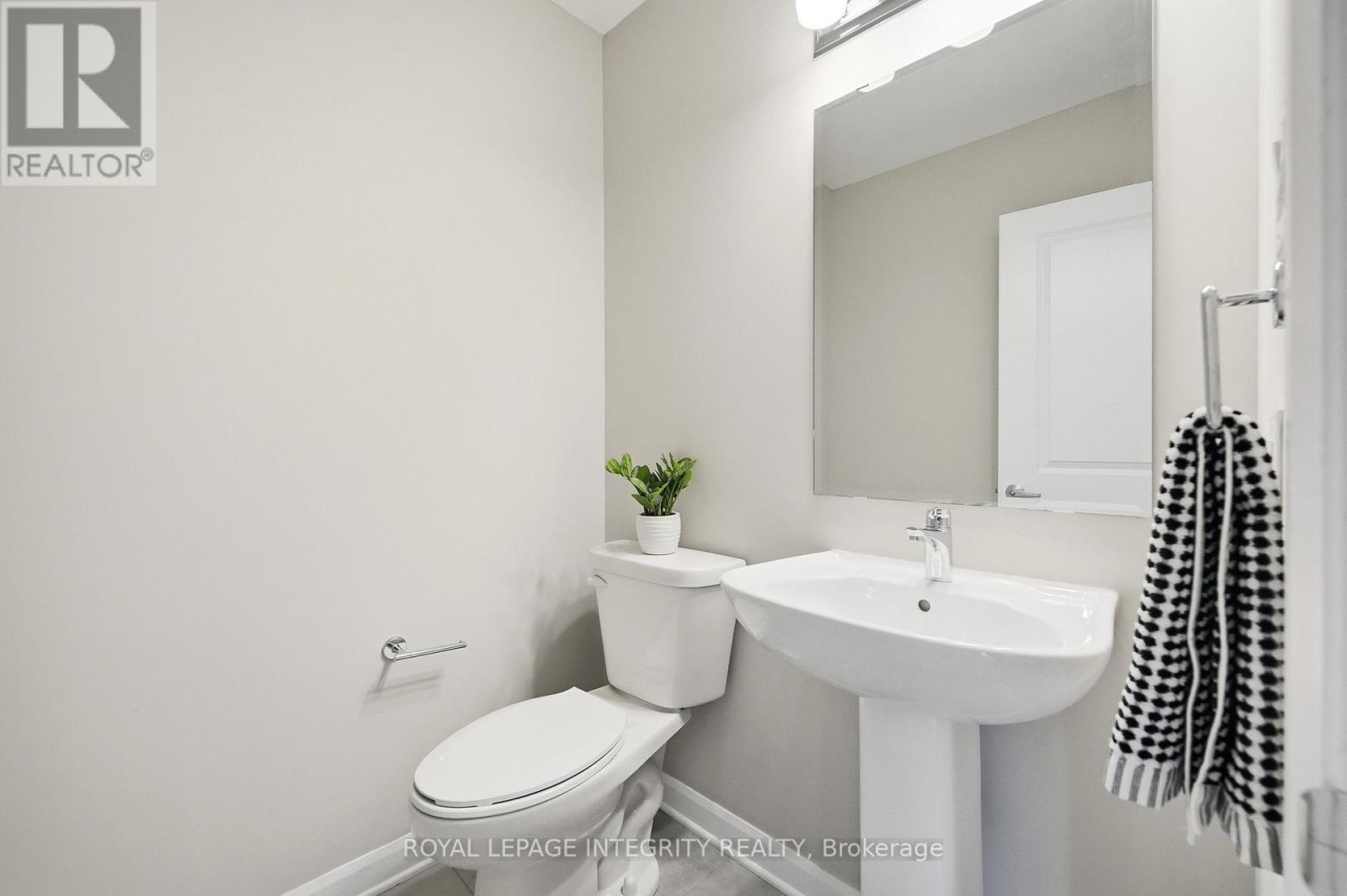 Main floor Powder Room with Tile flooring