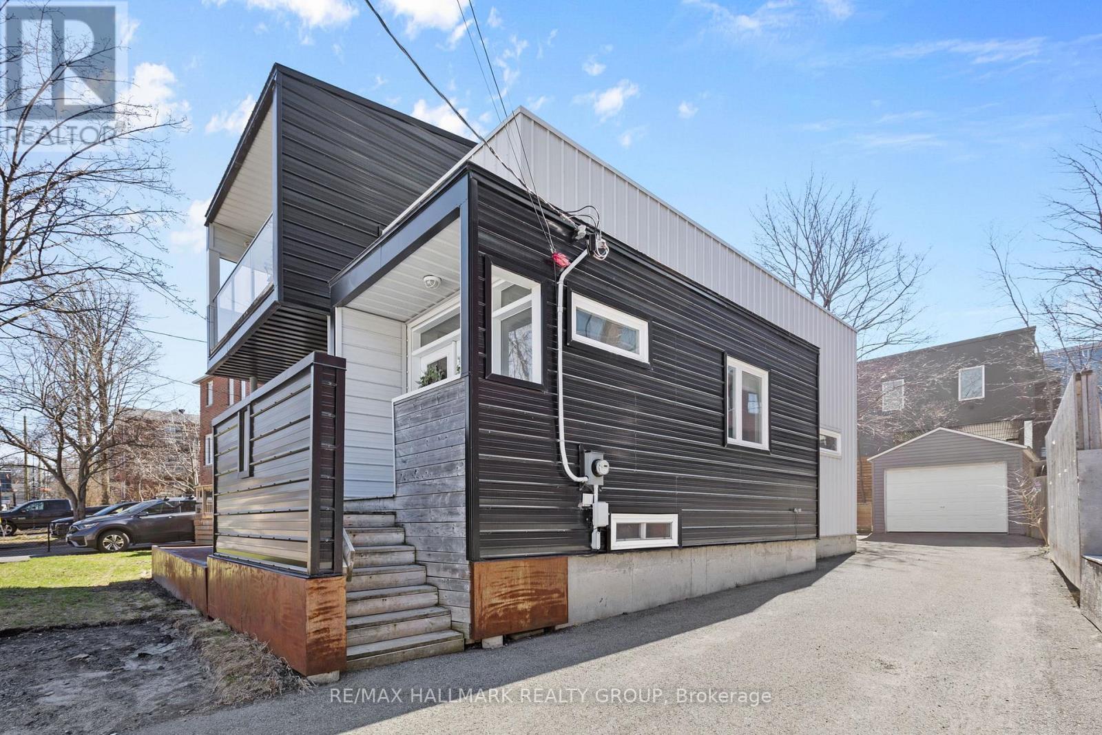 Exterior side with private driveway for 3 vehicles