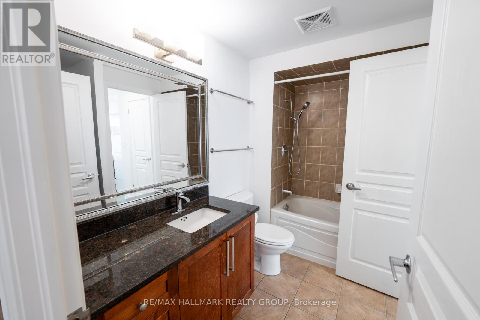 Bathroom with Granite Counter and In-Unit Laundry