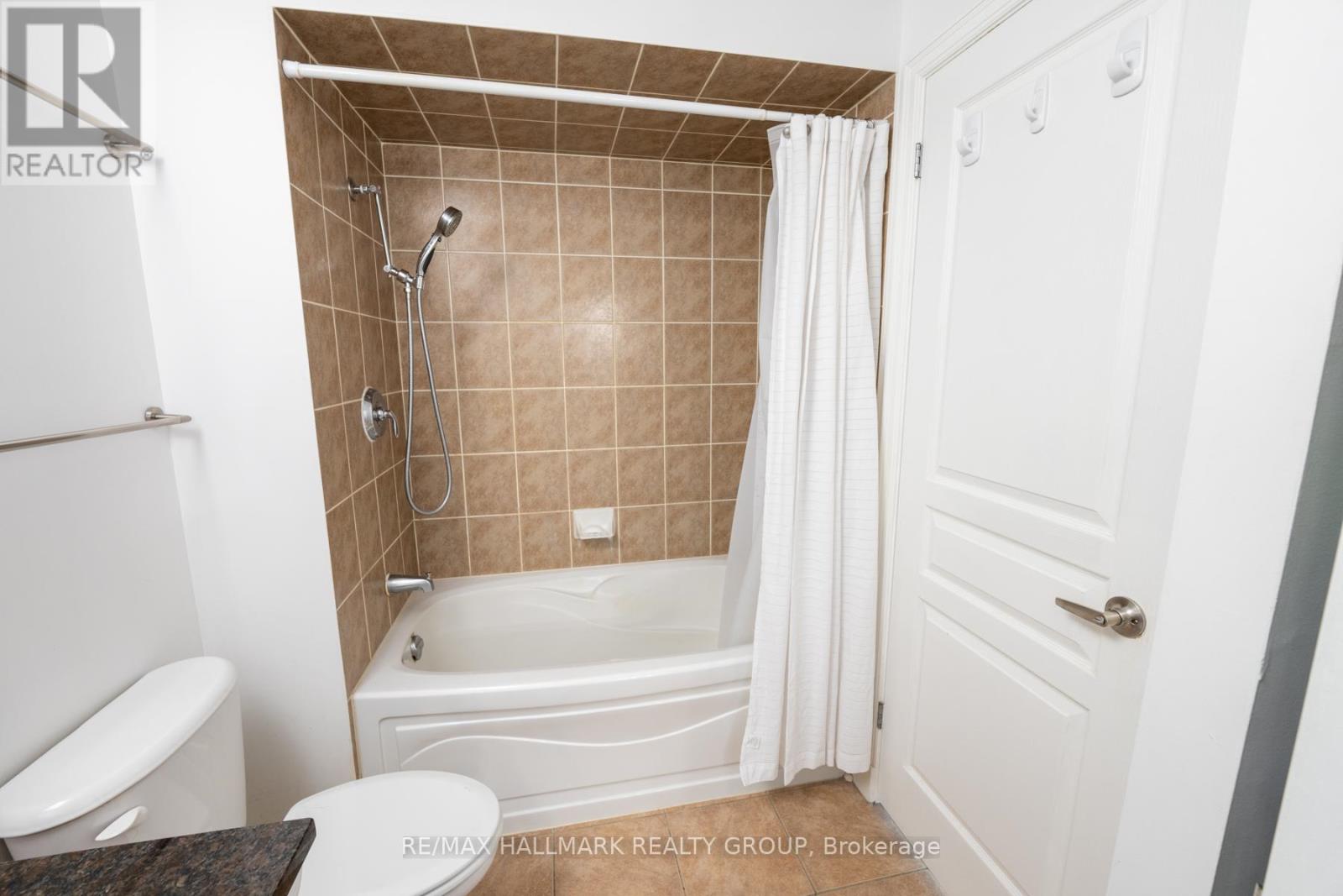 Bathroom with Granite Counter and In-Unit Laundry