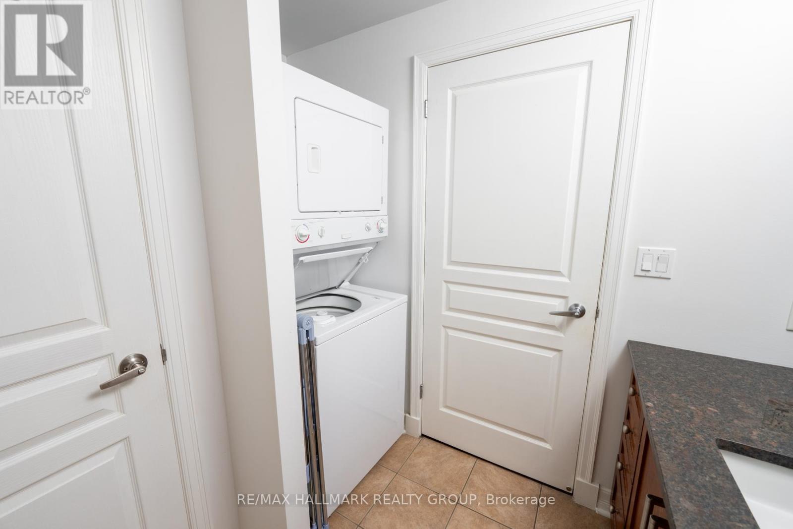 Bathroom with Granite Counter and In-Unit Laundry