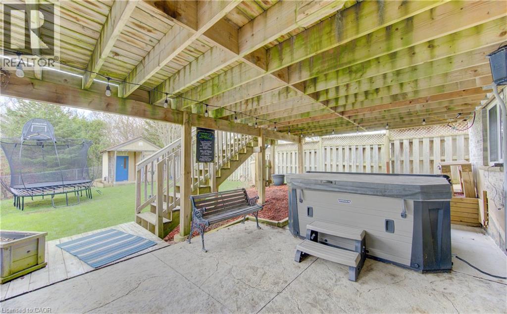 Under-deck patio area stamped concrete surface