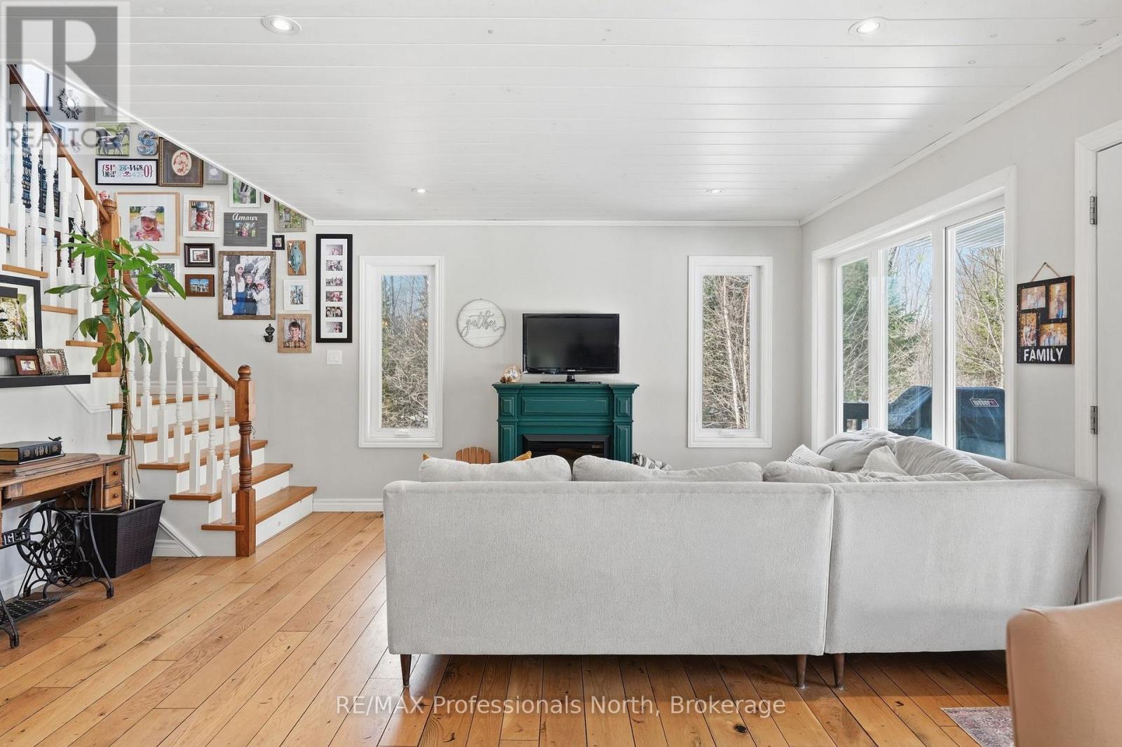 Open Concept living area with electric fireplace.