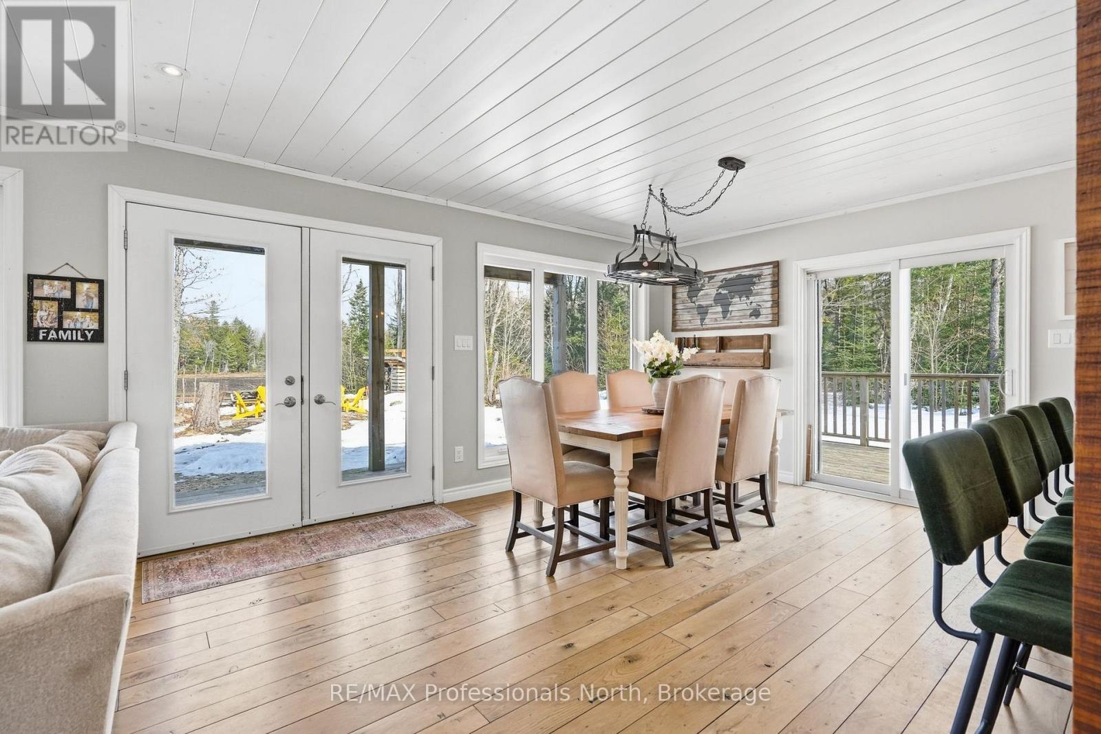 Open dining and living area with access to rear