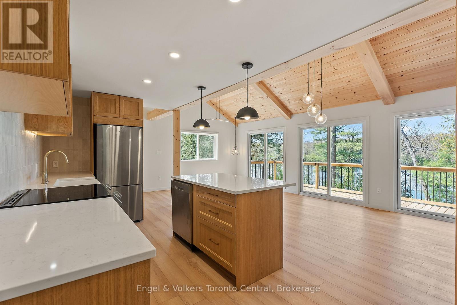 Lower cottage Kitchen w 3 walkouts with a view