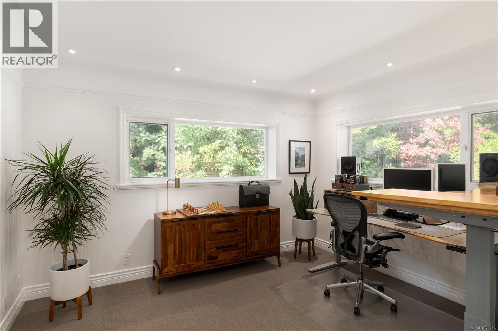 Private office or main floor bedroom space with garden-facing windows