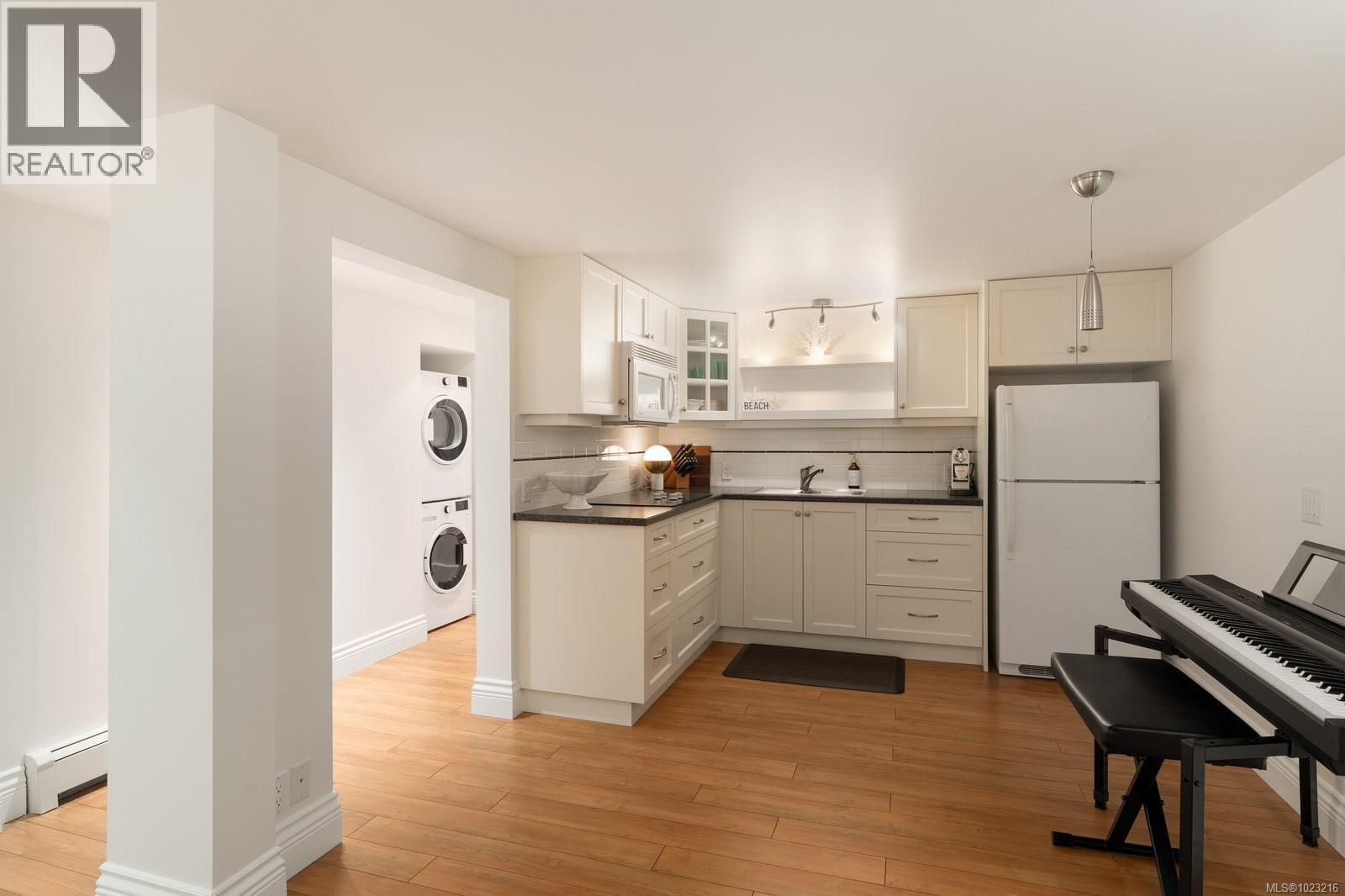 Fully equipped secondary kitchen on lower level -ideal for in-law or guest accommodations with new Washer and dryer