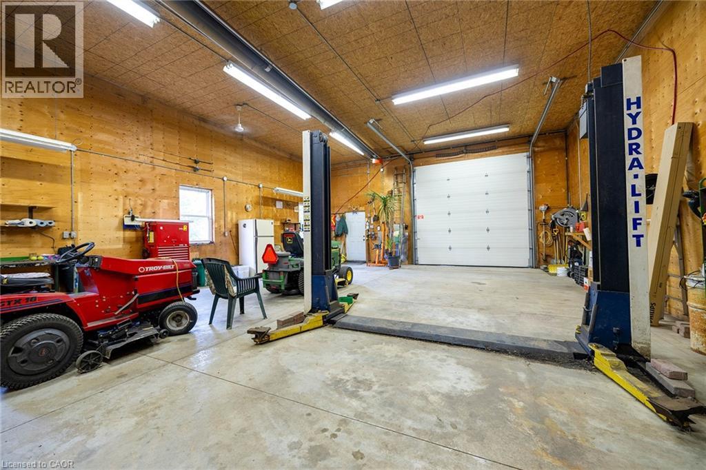 Interior of the shop. Hoist included. 12' x 12' insulated steel overhead door.