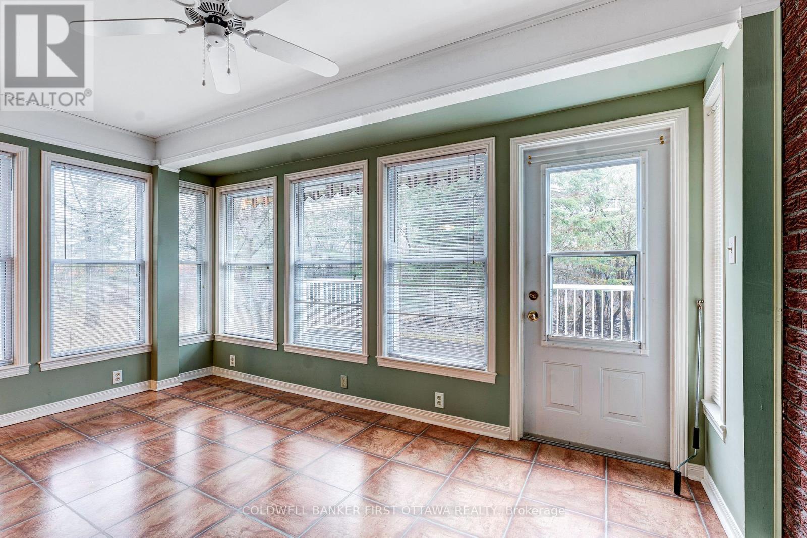 Sunroom walls of windows & door to backyard