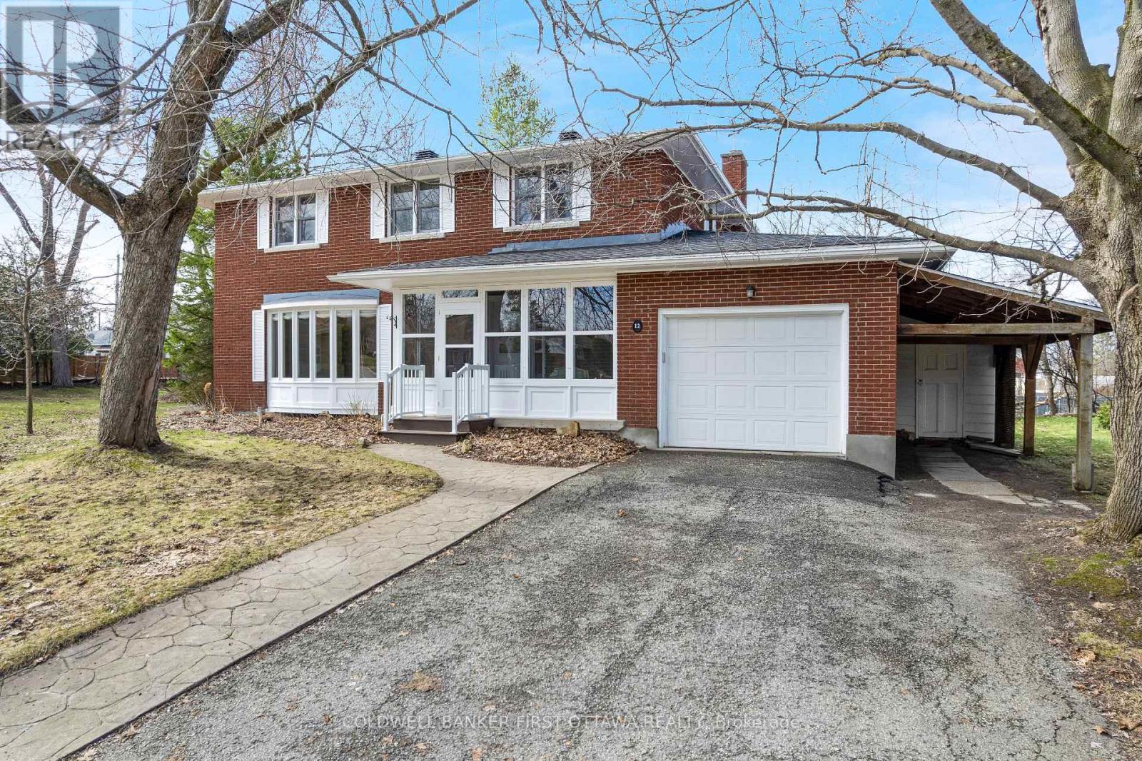 Home has attached garage with car port