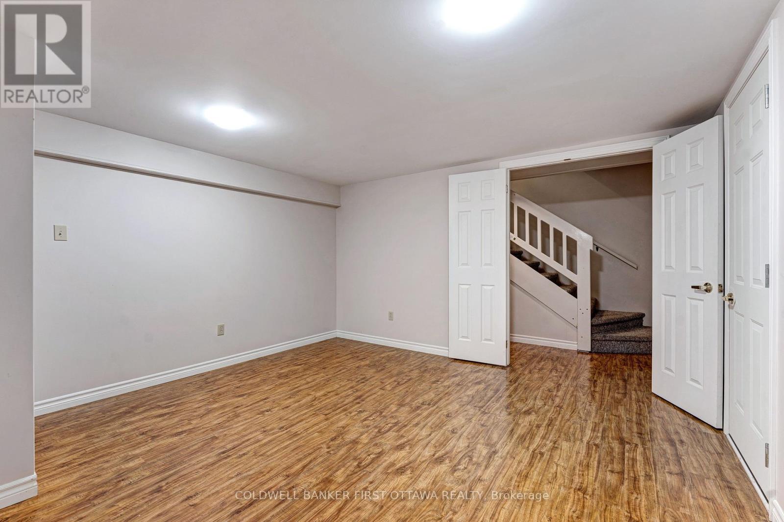 Lower level recreation room with laminate flooring