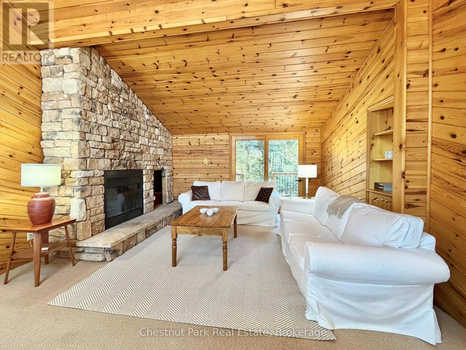 Great room with double glass doors to basic deck