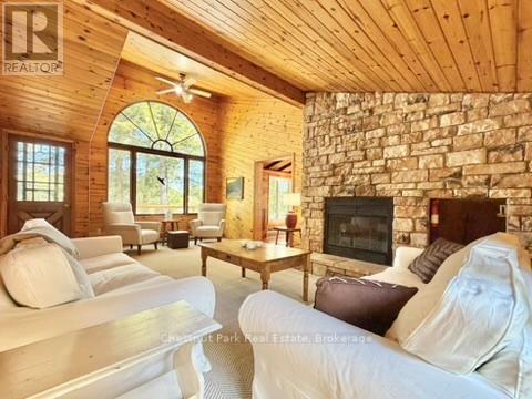 Cathedral ceiling & f-t-c cultured stone fireplace