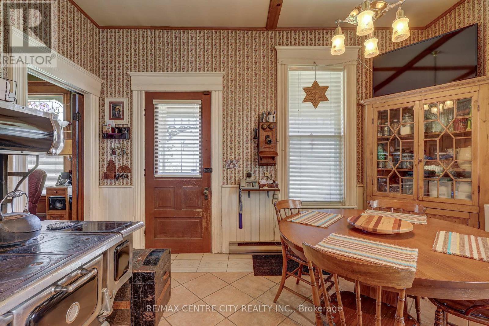 Kitchen with door to porch and breakfast area