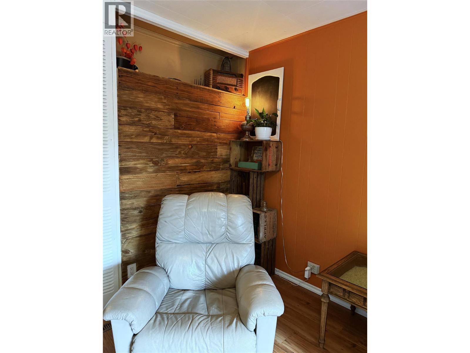 Living Room feature exposing 1920's vintage wooden wall.