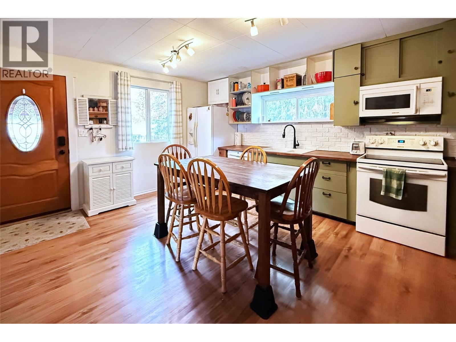 Main entrance opens into large eat-in Kitchen