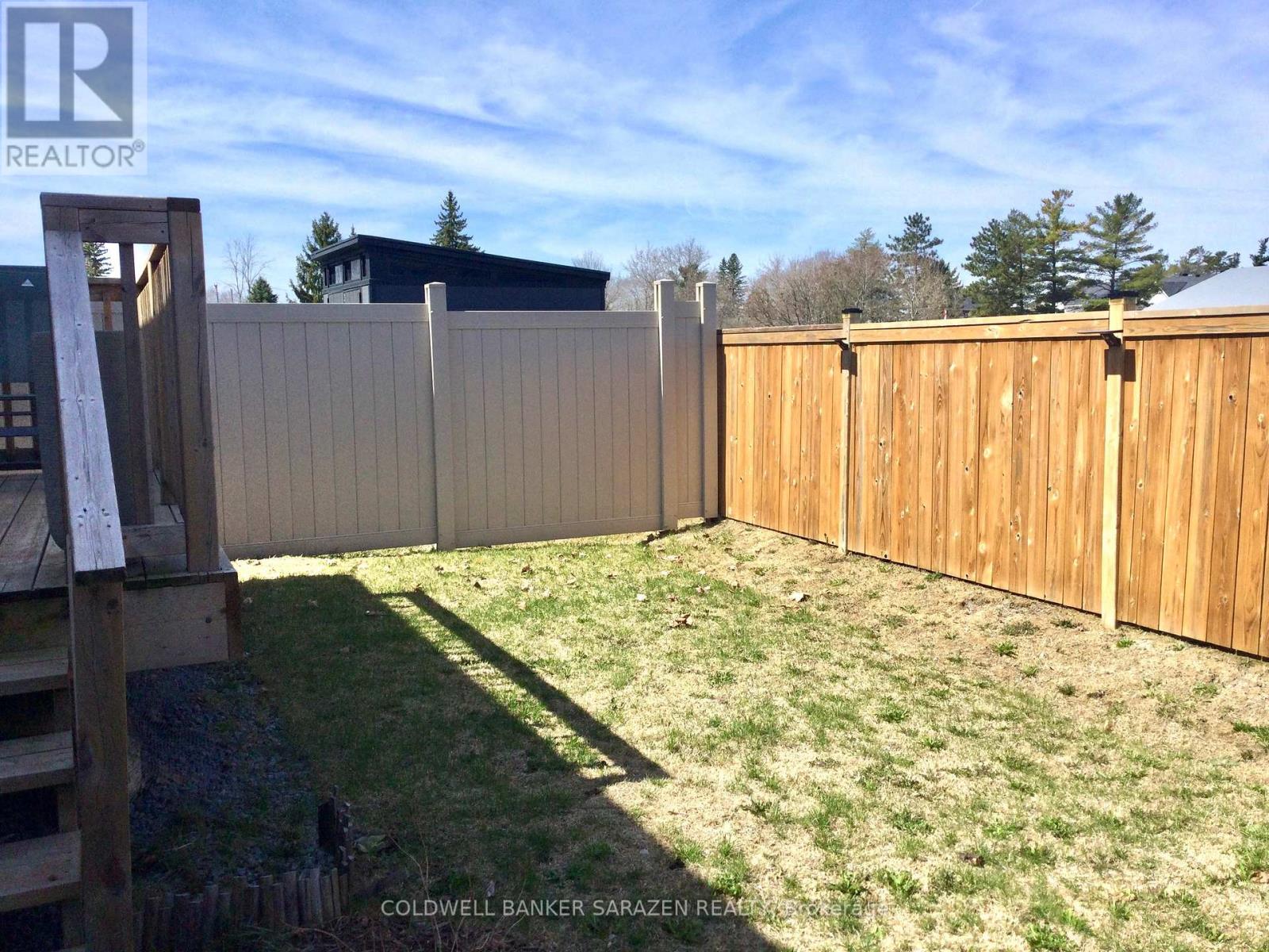 Fully fenced yard with side gate entry