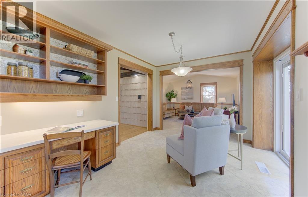 Integrated desk area with a white countertop and built-in wood cabinetry