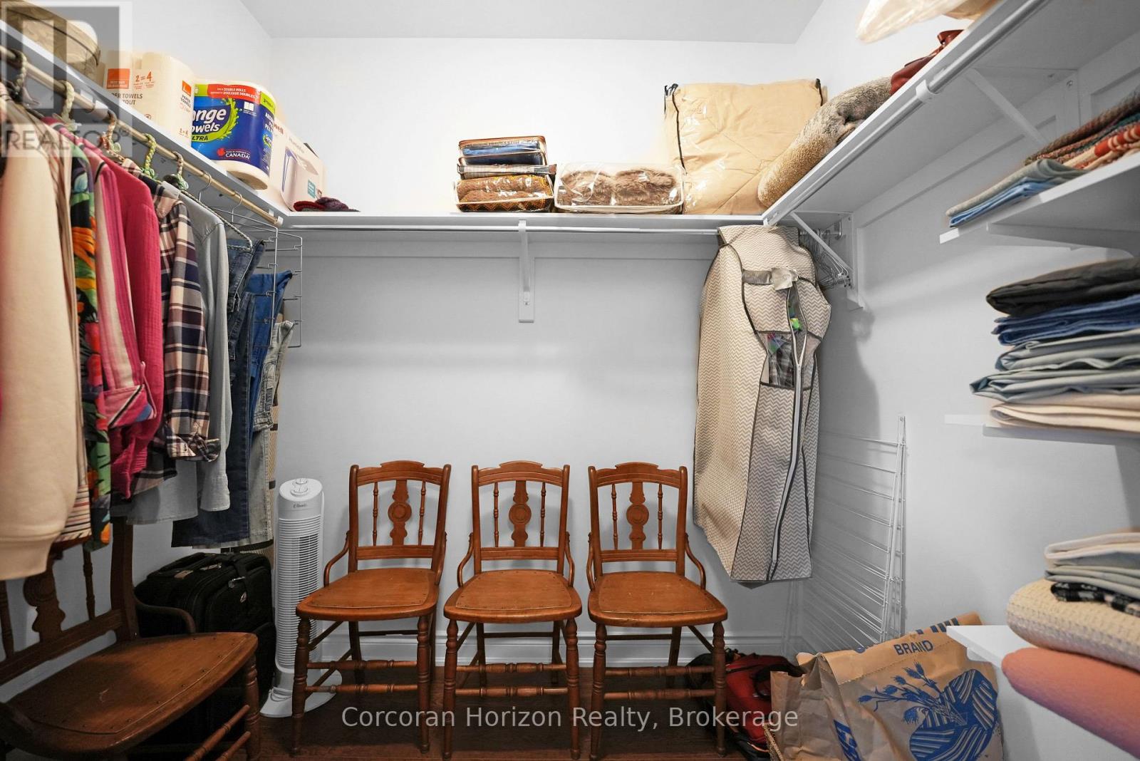 Primary bedroom walk-in closet