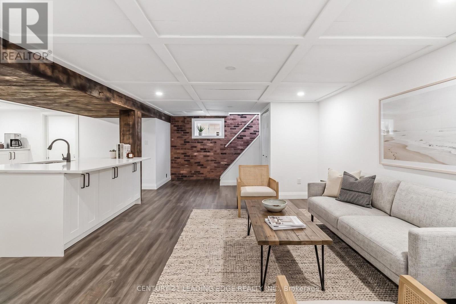 Virtually staged photo of lower rec room