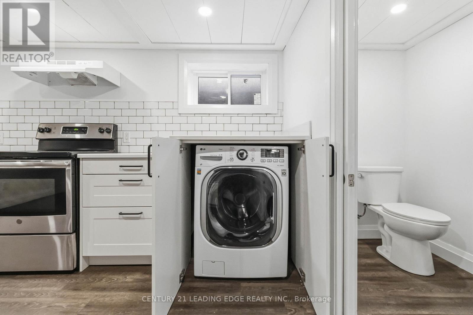 Combination washer and dryer unit in basement