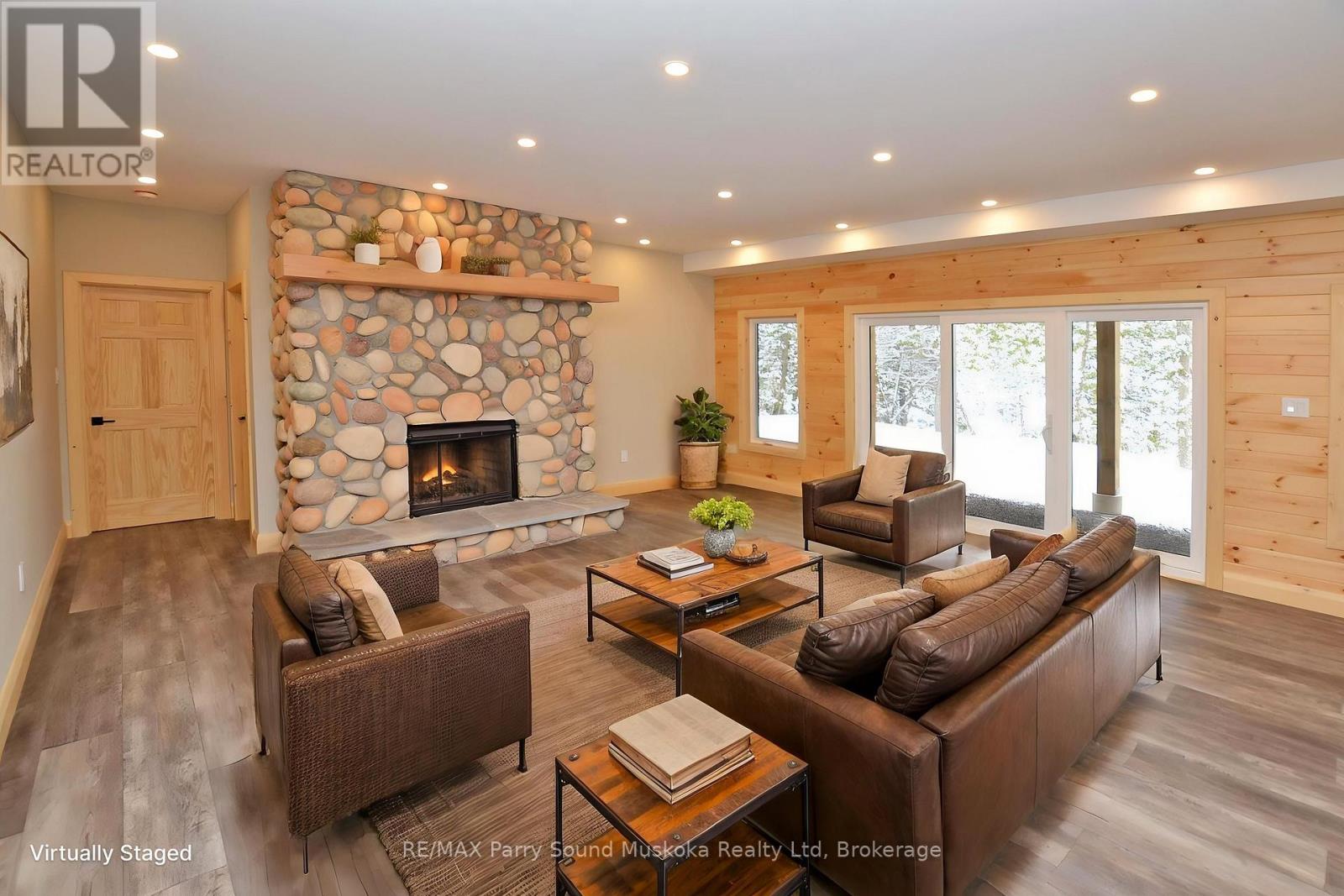 Family Rm w Walk Out & fireplace - staged