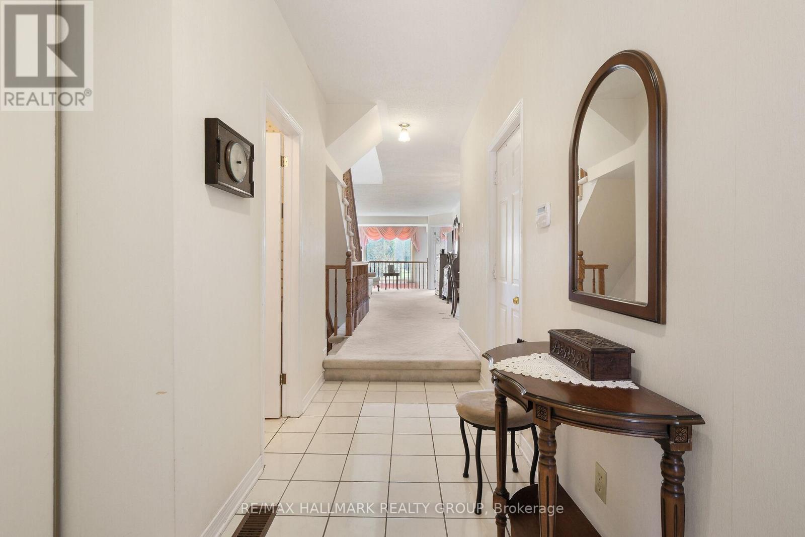 Large foyer with double closet and tiled floor.