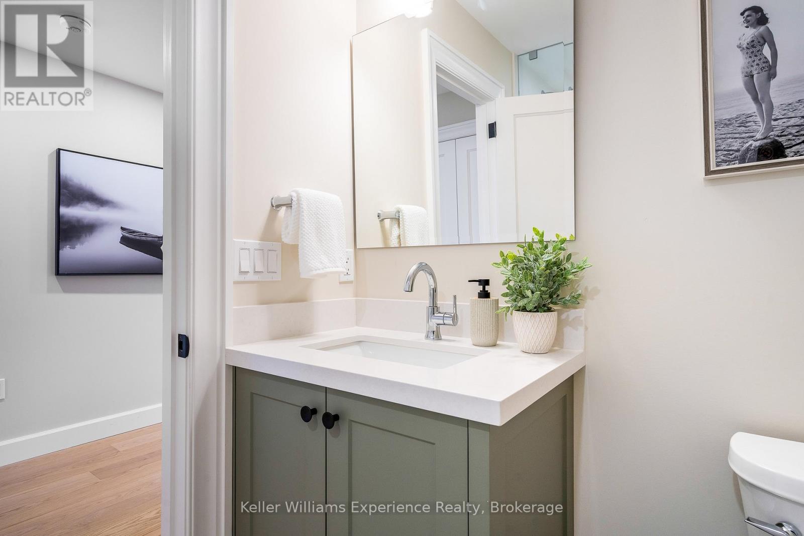 A Chic 3-Piece Bath Shared by 2 Upper Bedrooms