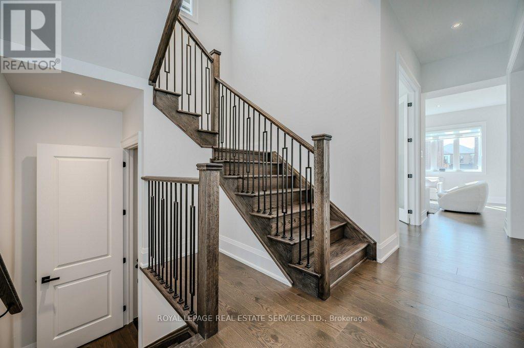 Elegant Oak Staircase with Wrought Iron Spindles