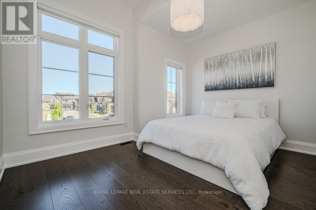 Fourth Bedroom with Wide Plank Hardwood Flooring